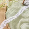 White lace-trimmed fabric with green heart-shaped cutout design, sewn, handmade DIY for decoration details Picture